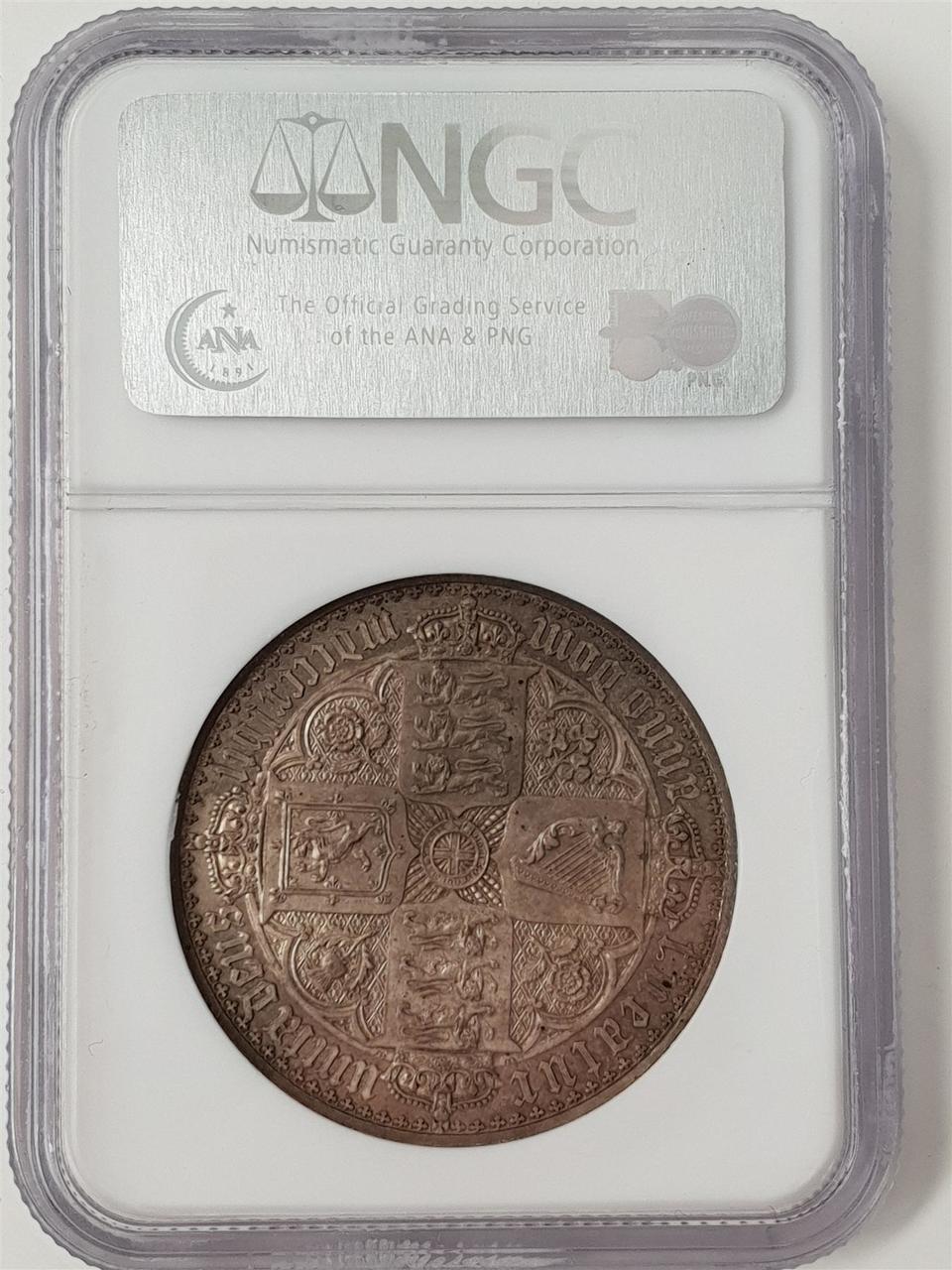 An 1847 Victorian gothic crown, Great Britain, encapsulated by NGC, reverse view of shields design created by William Dyce and engraved by William Wyon